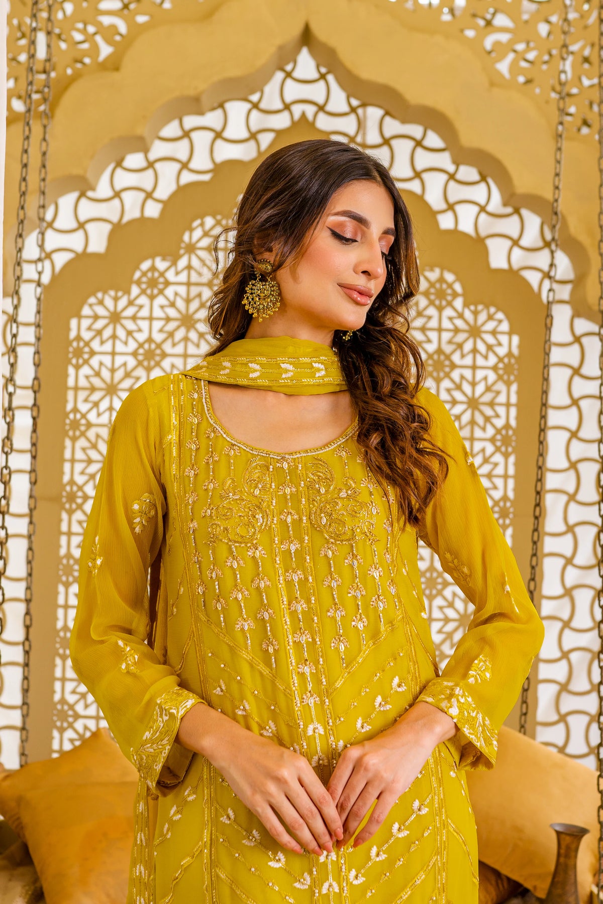 Woman standing portrait mustard chiffon Pakistani suit Canada Sheep brand hand embellished festive women