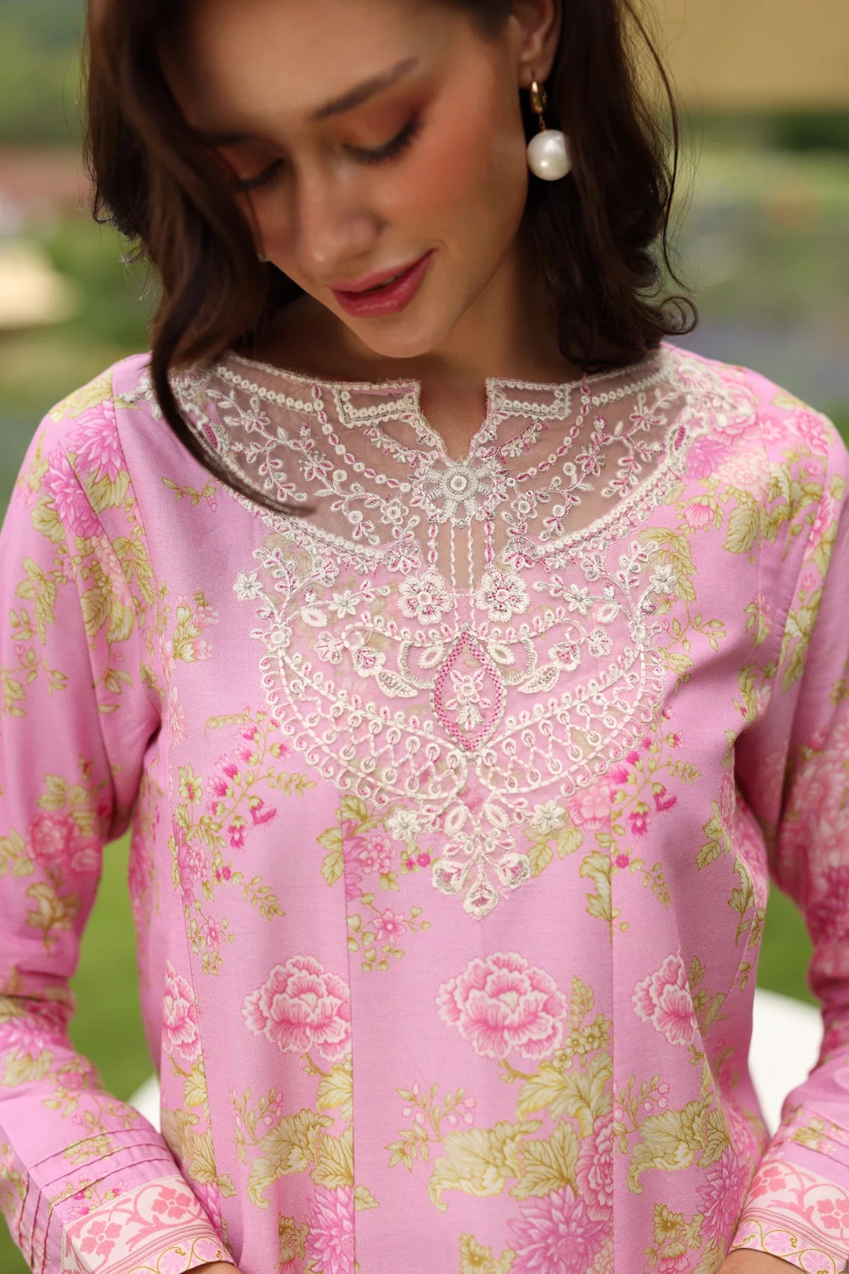 Woman close-up portrait Xenia Cerulean-A pink floral lawn gown white lace embroidered neckline Eid Pakistani suits Canada