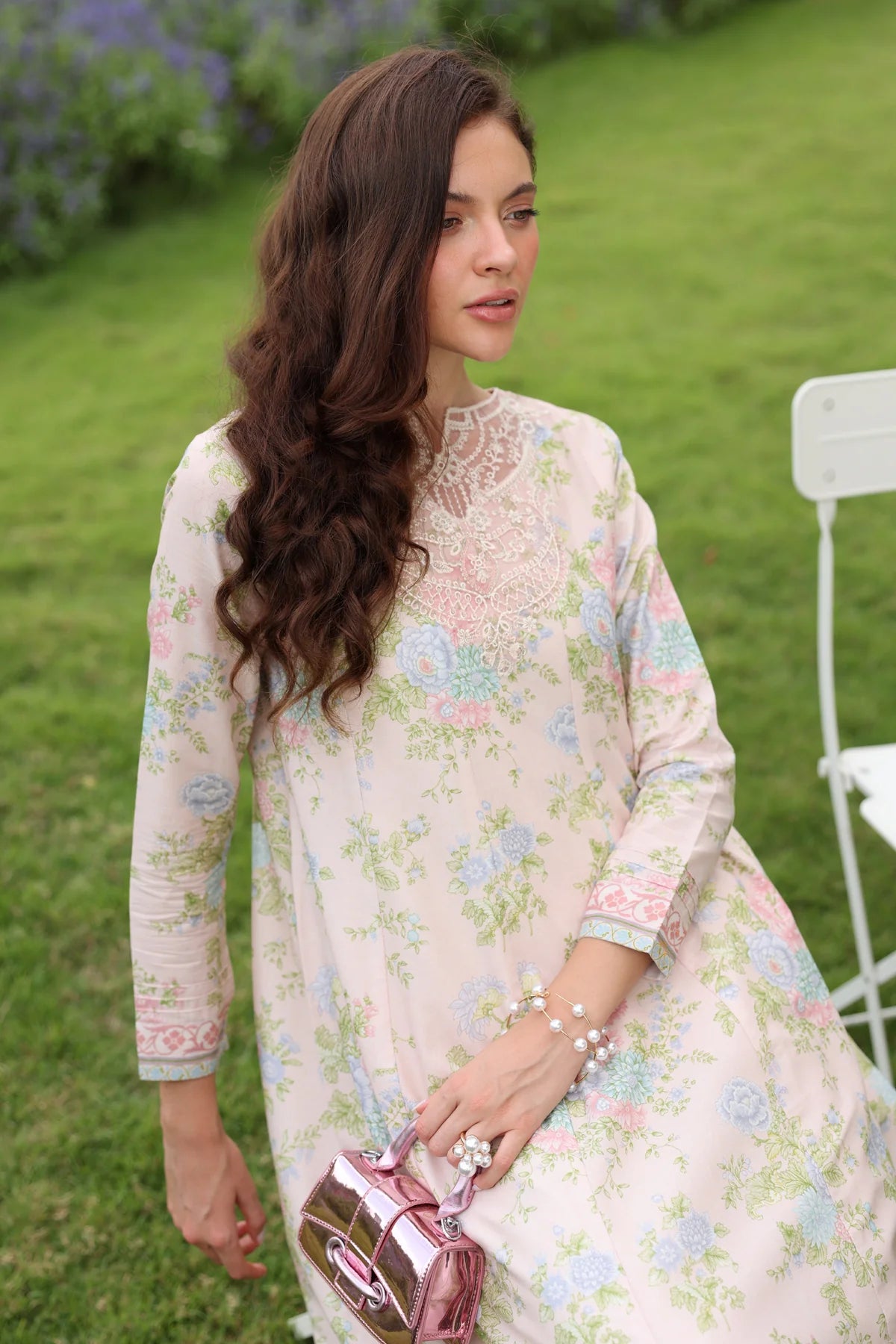 Woman close-up portrait Xenia cream lawn gown white crochet lace embroidered neckline cuffs pastel floral Eid Pakistani suits Canada
