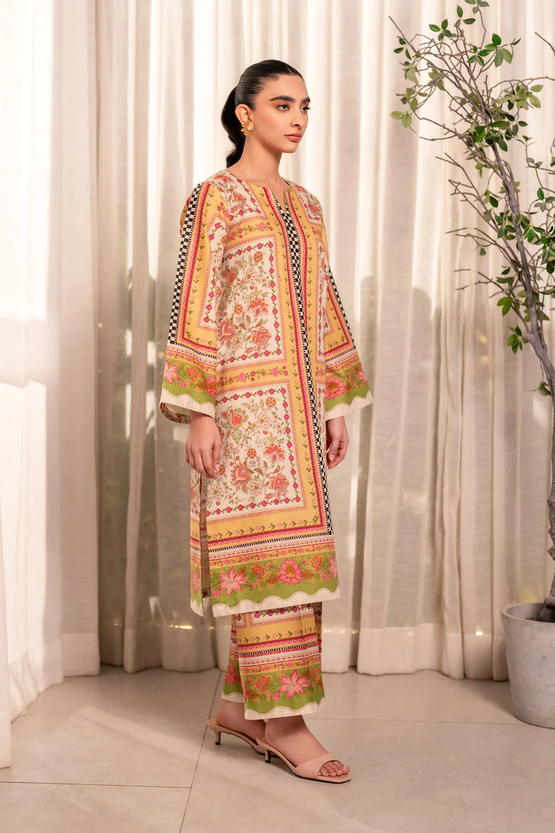 Woman standing editorial front view Xenia Elia floral printed lawn 2-piece suit traditional festive Pakistani suits Canada
