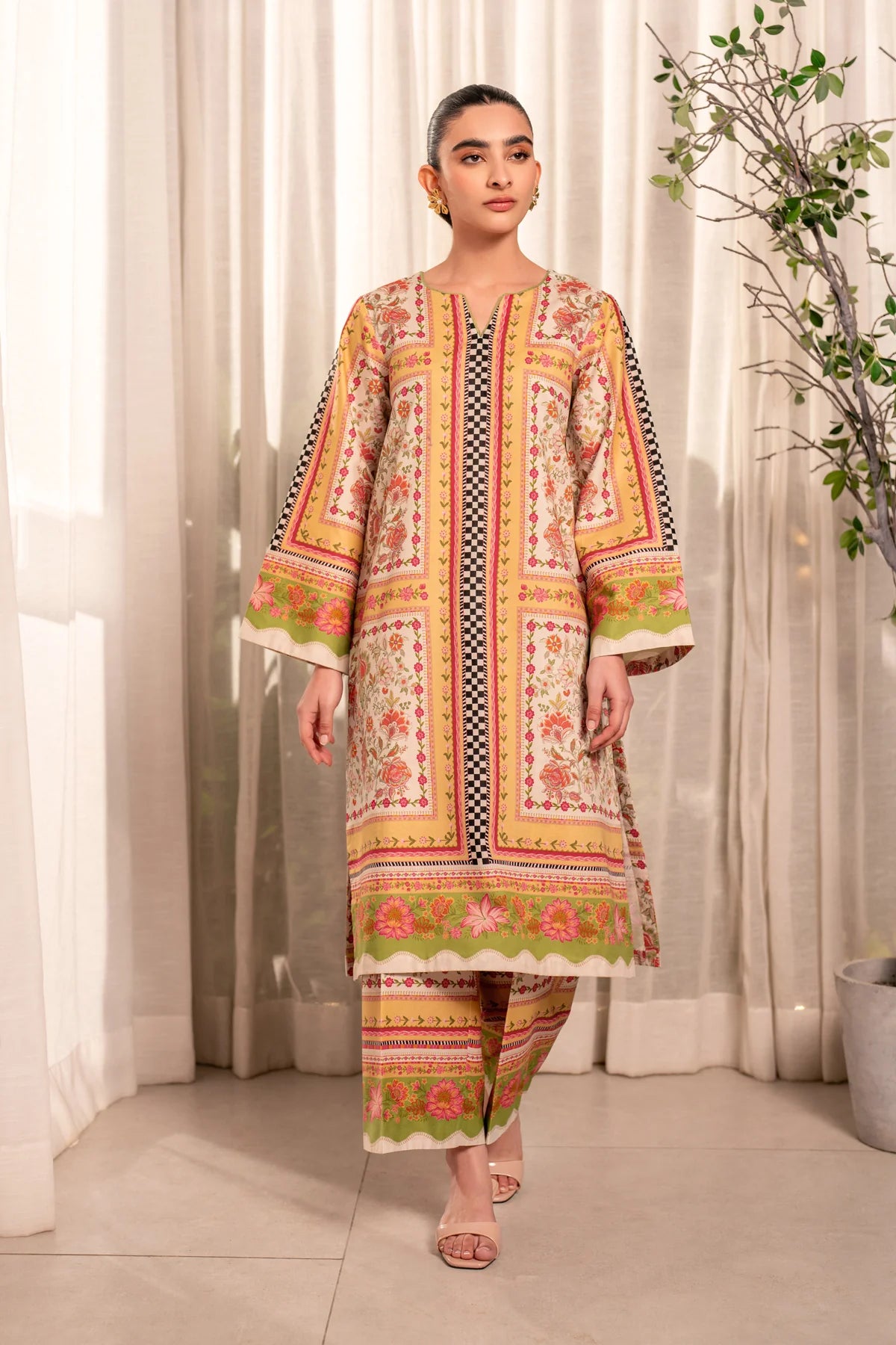Woman standing full length front view Xenia Elia floral printed lawn 2-piece suit festive wedding Pakistani suits Canada