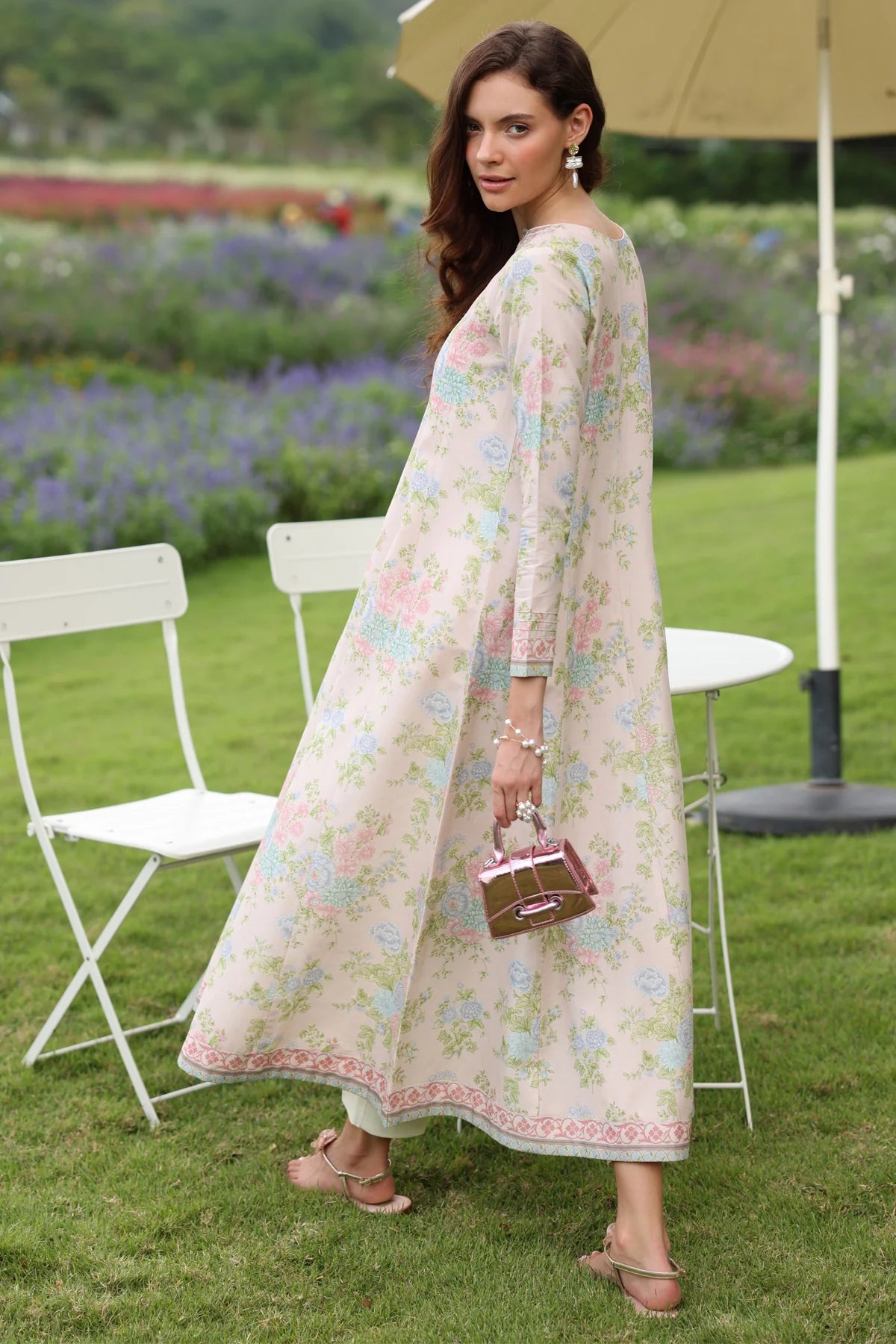 Woman standing full length side view Xenia cream floral lawn gown A-line silhouette embroidered hem Indian suits Canada