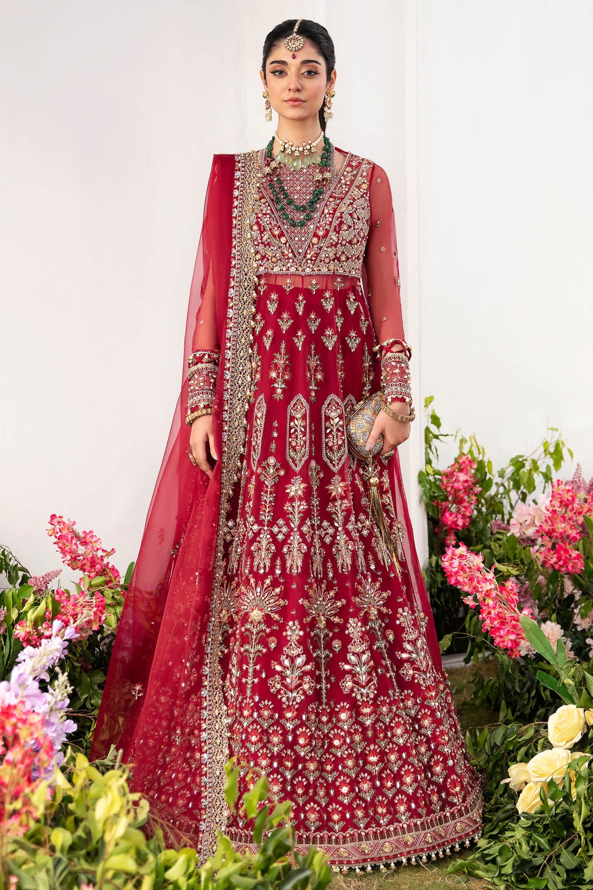 Elegant ruby red embroidered organza maxi in standing pose showing complete intricate craftsmanship and flowing silhouette - Zaha 
