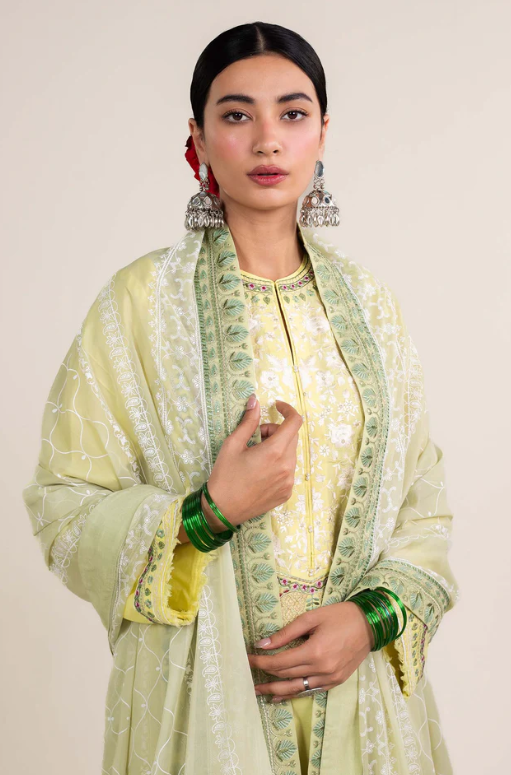 Woman portrait close-up wearing Zara Shahjahan lime-yellow jacquard kurta with embroidered neckline and mint silk dupatta, Punjabi suit in Canada